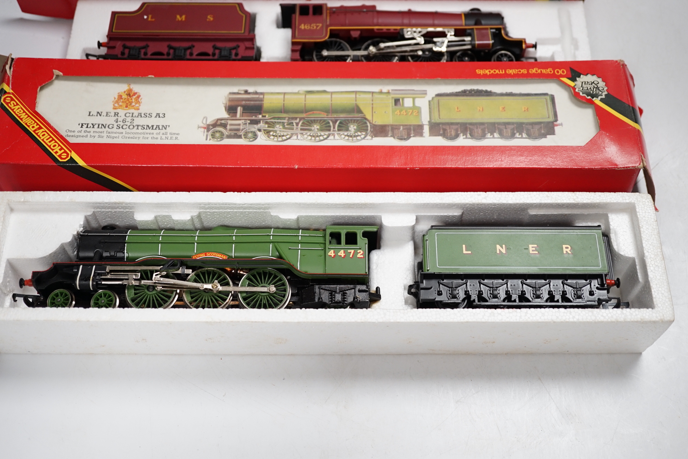 Five boxed Hornby Railways 00 gauge locomotives including; an LMS Black Five (R840), an LMS Class Five (R842), a BR Class 9F (R065), an LNER Class A3 (R 855), and a BR Class 3F (R058)